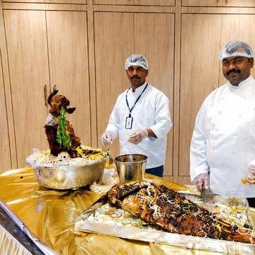Chef presenting a signature dish for a Delicacies private celebration